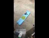 Dog pees on folded up puppy pad 