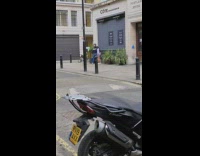 White sweater girl sidewalk cote brasserie motorcycle 