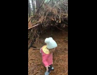 Little girl knows to not approach shelter in woods