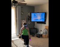 Woman plays VR game punches tv