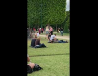 Blonde girl kick pose Eiffel tower crowded