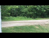 Guy drifts go kart on dirt road