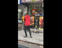 Guy Practices Punches Near Waiting Dog 