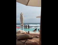 Three women bikini poses by the pool