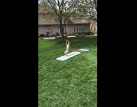 Little girl practicing tumbling skills does scorpion 
