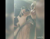 Black brown white kitten licks girl face