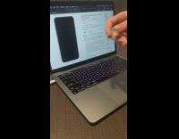 Guy grabs iphone picture macbook video editing 