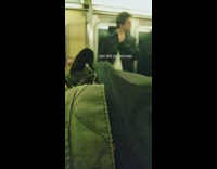 guy is shaving his face on moving subway car 