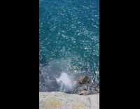 Guy does backflip jump off cliff into water 