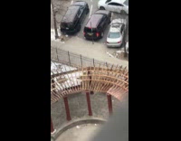 Car blocked tries to back up on sidewalk