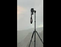 Collab IITW - Woman in brown dress spins in repeat at the cliff