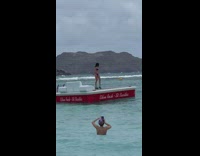 Woman bikini rollerblades on beach float platform