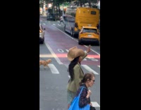 Woman wearing tall straw fedora hat