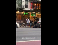 Old man sing dance with microphone street