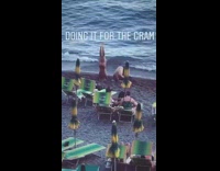 couple does headstand for beach photo