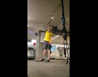 Man does one hand pull up 