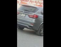 Woman in floral skirt tiktok dance in front of the men