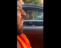 Man makes strange facial expression looks at strangers 