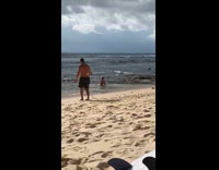 Bunch of people poses for a different photoshoot on the beach