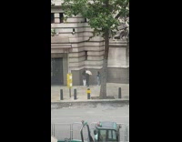 Woman white shirt pose on wall corner