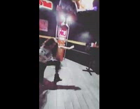 Woman kicks arcade game punching bag falls 