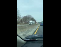 Collab WINY - White truck backs up on the highway