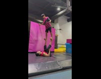 Man stand on another feet backflip failed