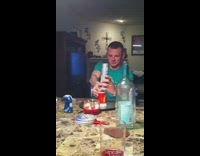 Guy at dinner table lights it on fire