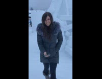 Woman takes selfie with igloo