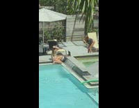 White bikini girl poses pool laptop window 