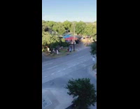 Two guys jump large balloon ring rock