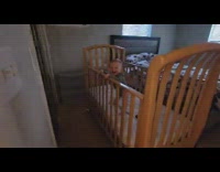 Baby laughs as he stands in his crib for the first time