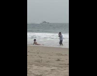 Woman bikini lie down photographer shoes wet