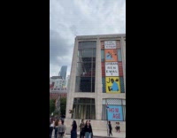 Man Stormtrooper costume stare from building window