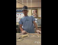Man Flirts as he Make Pretzel Dough