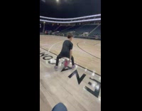 Nine year old boy dribbles basketball