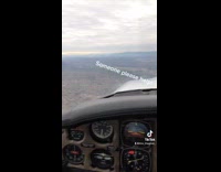 Girl googles how to land airplane while in small plane 