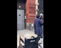 Three guys dance on sidewalk to music 