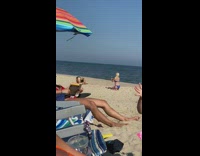 Girl black bikini headstand beach umbrella book