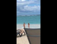 Woman hair whip spin run towards beach