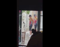 Two guys black hat jersey top dance