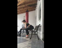 Girl doing squats on bench and pets dog every time she goes down