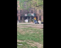 Trash flies out of trash can on guys head 