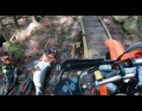 Guy rides motorbike over skinny bridge