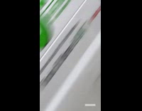 Man Shakes Maracas in Red Car 