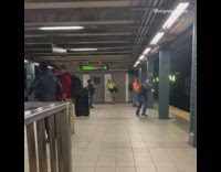 Guy punches air train platform messenger bag 