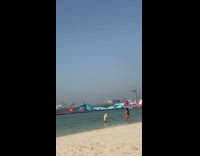 Red yellow bikini beach water 