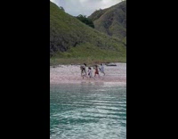 Group of women run on beach drone