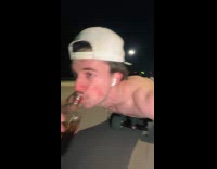 Guy drinks while skateboarding on belly 