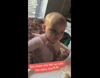 Baby tries spicy rice shocked face